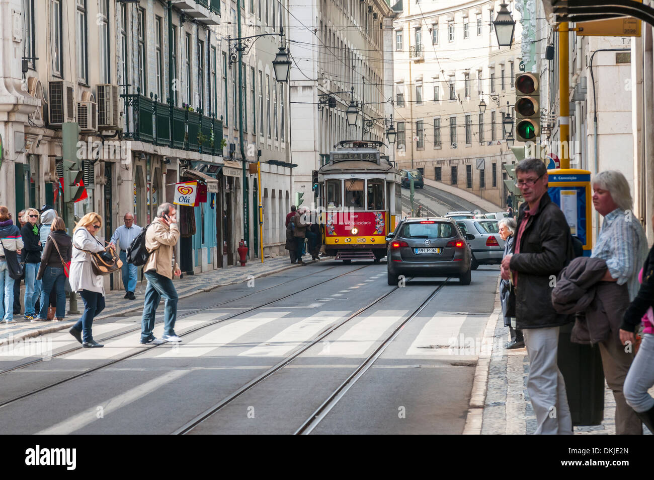 The sights of, overlooking, around, in the city town of  Lisbon, Portugal, Europe. People shopping and tram. Typical Street Stock Photo