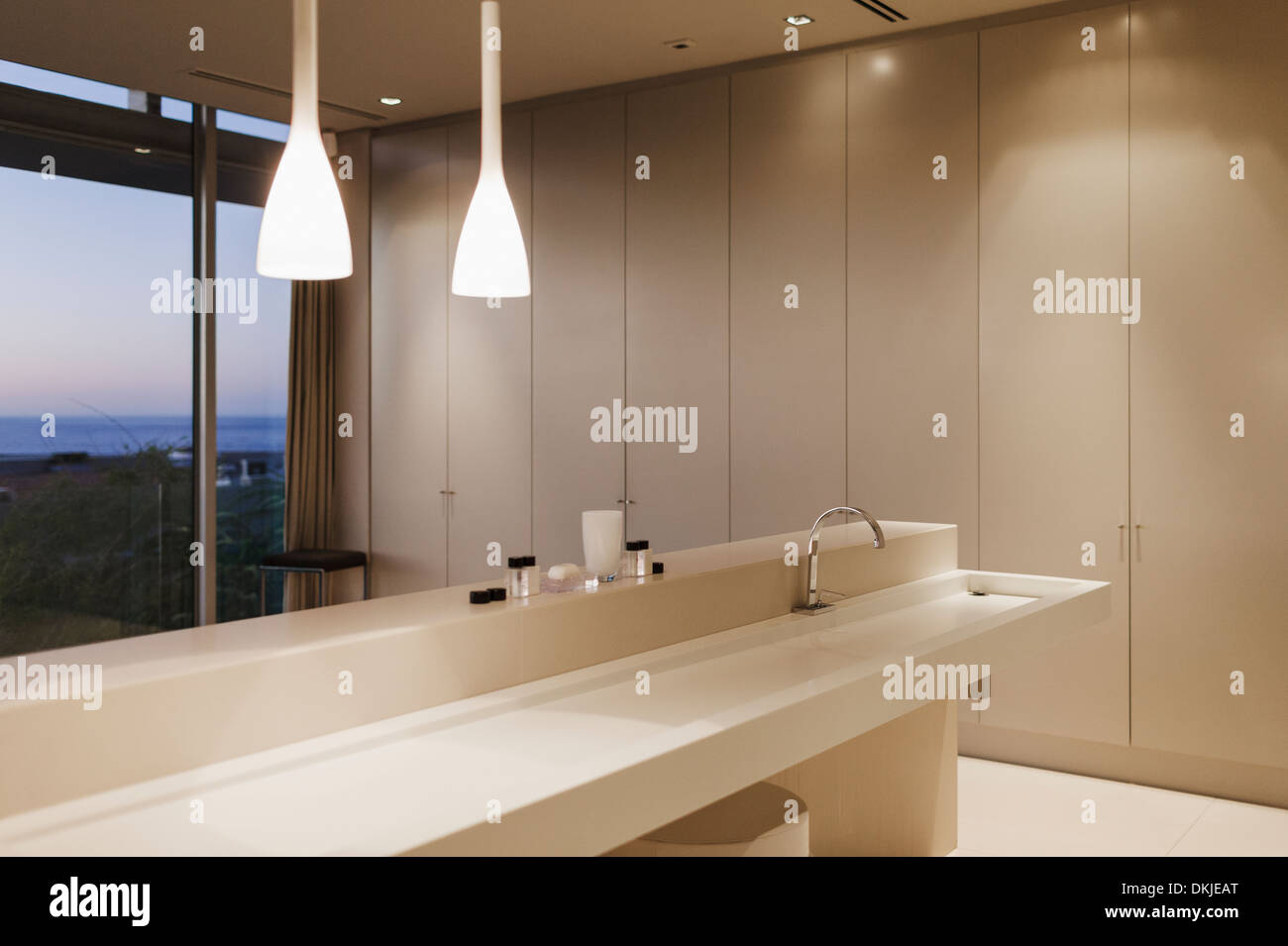 Sink and pendant lights in modern bathroom Stock Photo