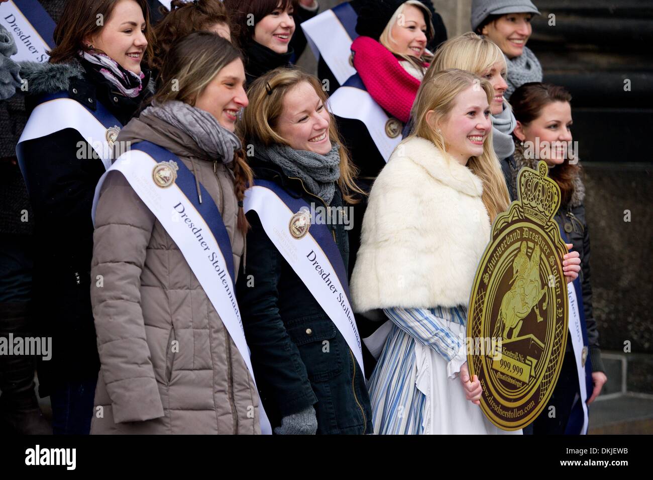 Dresden, Germany. 06th Dec, 2013. Current Dresden Stollen Girl Friederike Pohl (4-L) poses with her predecessors during the 'class reunion' of the stollen girls in Dresden, Germany, 06 December 2013. A Stollen Girl is appointed every year since the second Stollen Festival in 1995. Photo: SEBASTIAN KAHNERT/dpa/Alamy Live News Stock Photo
