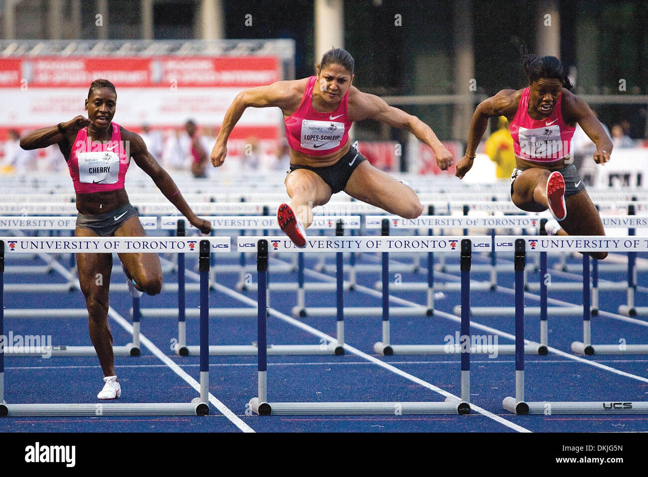 June 11, 2009 - Toronto, Ontario, Canada - 11 June 2009:  Priscilla Lopes-Schleip of Canada (center), edged out fellow teammate Perdita Felicien (right) in the Women's 100 Meter Hurdles at University of Toronto's Festival of Excellence. Lopes-Schleip completed her sprint at a time of 12.86 -  beating Felicien  by a margin of 2 one-hundredths of a second. (Credit Image: © Southcreek Stock Photo