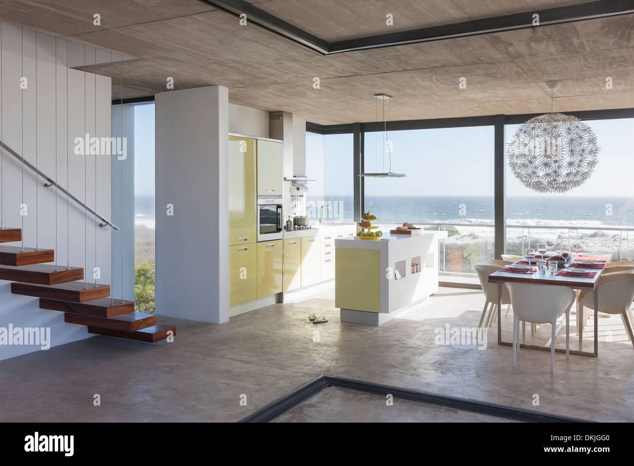 Modern kitchen and dining room overlooking ocean Stock Photo - Alamy