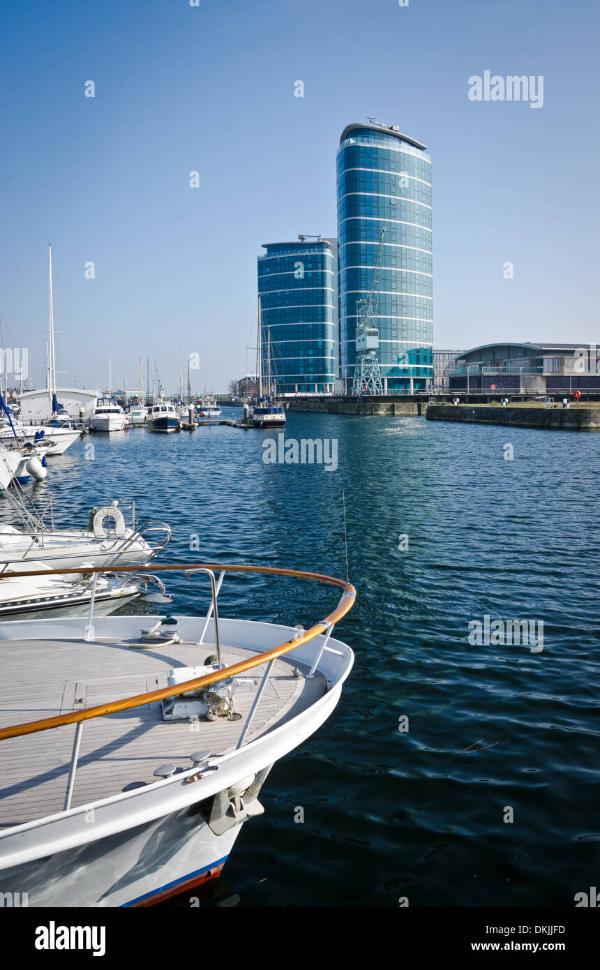 Boats in Chatham Maritime Marina with two blue towerblocks in the distance Stock Photo