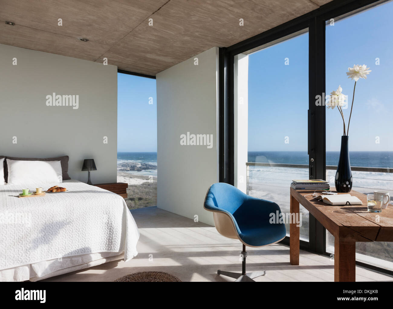 Modern bedroom overlooking ocean Stock Photo Alamy