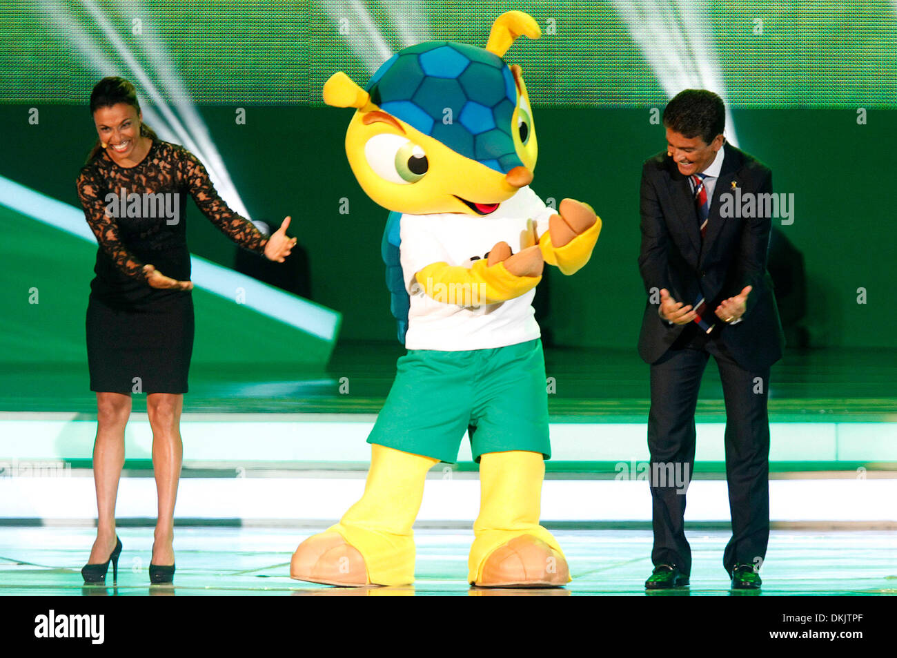 Costa Do Sauipe, Brazil. 6th Dec, 2013. Former Brazilian soccer player Jose Roberto Gama de Oliveira, also known as Bebeto (R), Brazilian soccer player Marta Vieira (L) and the mascot Fuleco (C) perform during the ceremony of the final draw for the groups and matchups of the 2014 FIFA World Cup Brazil in Costa do Sauipe, Brazil, on Dec. 6, 2013. Credit:  Xinhua/Alamy Live News Stock Photo