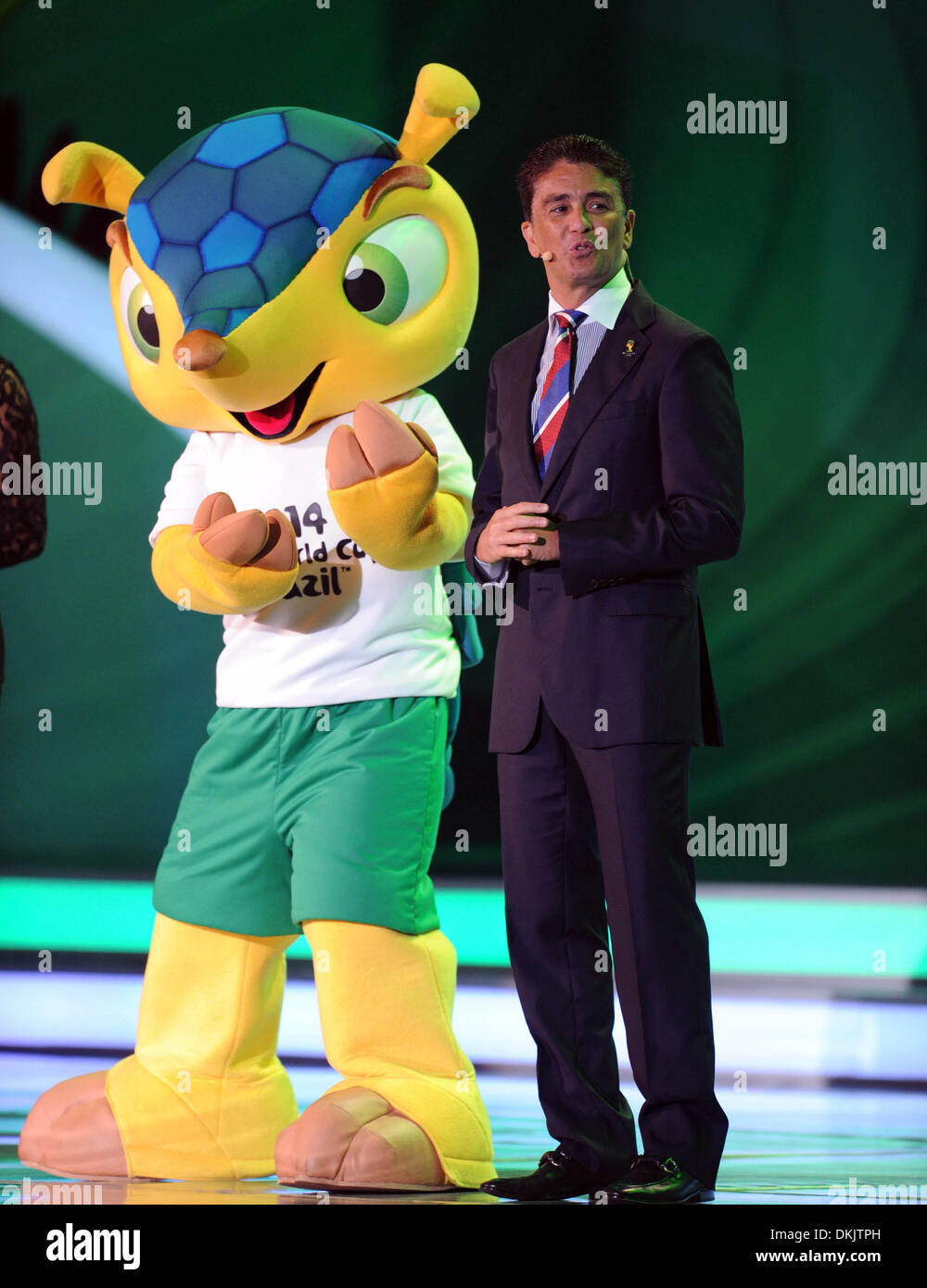 Costa Do Sauipe, Brazil. 6th Dec, 2013. Former Brazilian soccer player Jose Roberto Gama de Oliveira, also known as Bebeto (R), and the mascot Fuleco (L) attend the ceremony of the final draw for the groups and matchups of the 2014 FIFA World Cup Brazil in Costa do Sauipe, Brazil, on Dec. 6, 2013. Credit:  Xinhua/Alamy Live News Stock Photo