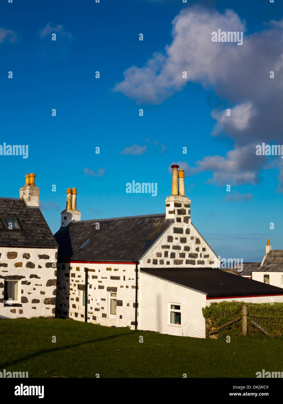 Traditional white painted stone cottages at Scarinish on the Isle of Tiree Inner Hebrides Argyll and Bute Scotland UK Stock Photo