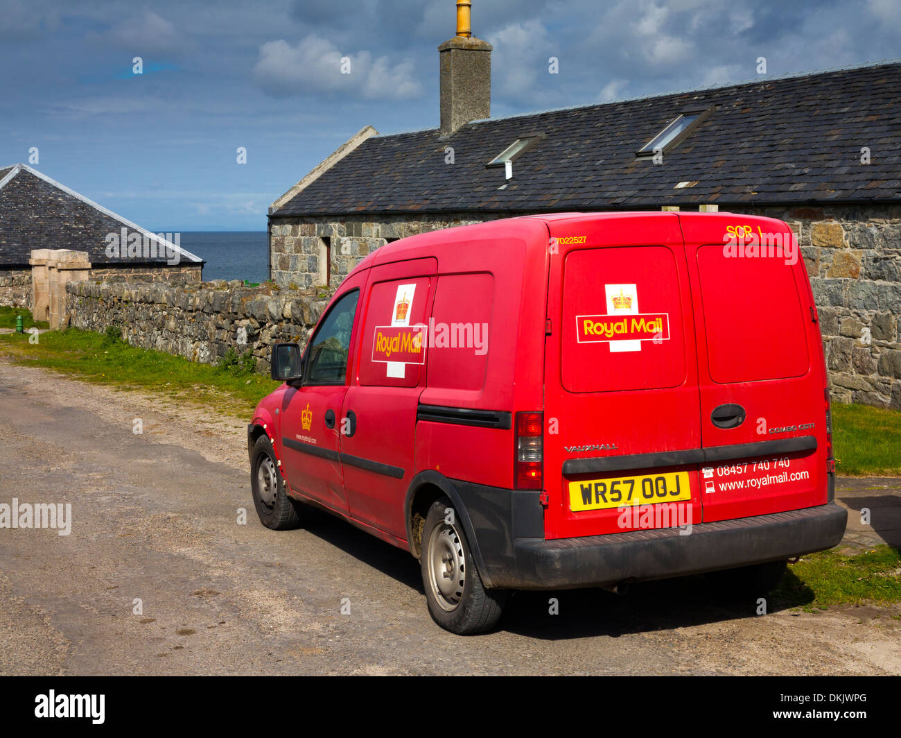 Red British Royal Mail delivery van delivering post on the Isle of