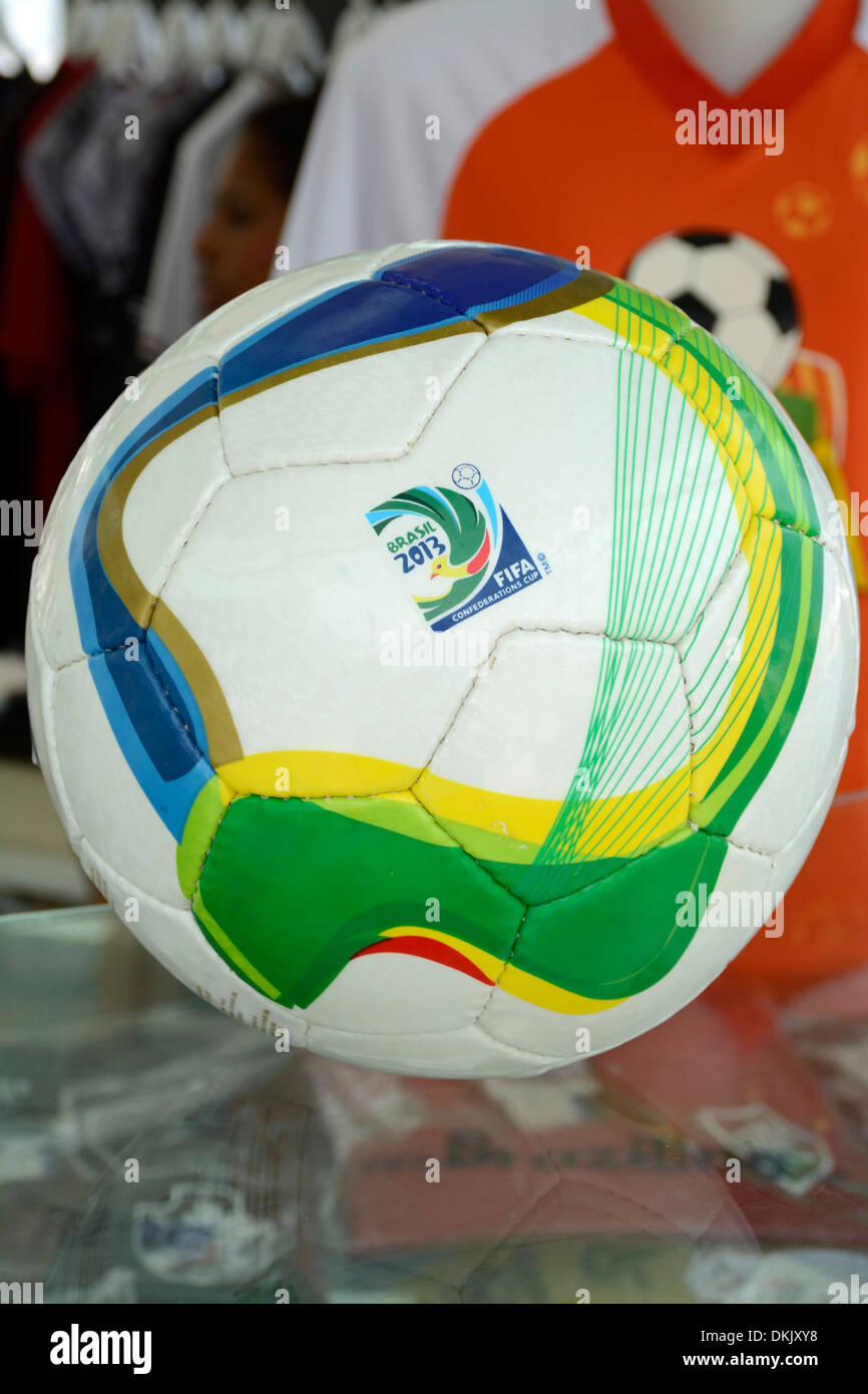 A football bearing official Brazil World Cup 2014 on sale at a football souvenir kiosk on Copacabana beach, Rio de Janeiro, Brazil Stock Photo