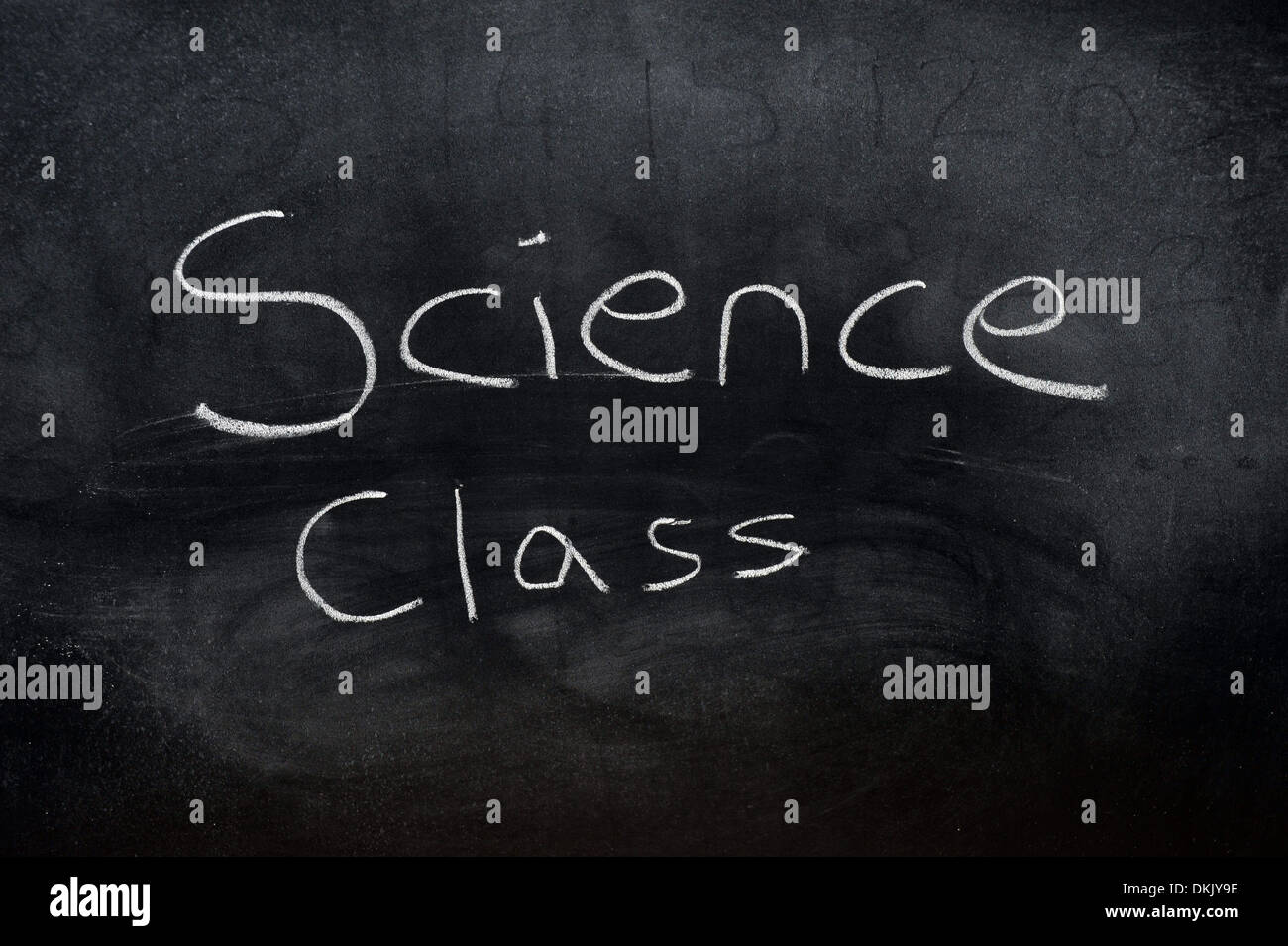 A blackboard with the words Science Class written on it in white chalk