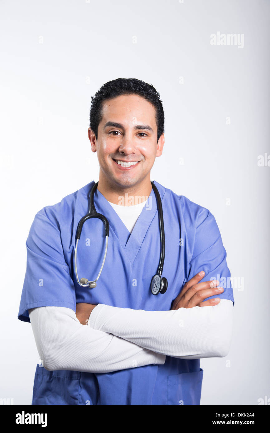 Smiling male nurse with arms crossed Stock Photo