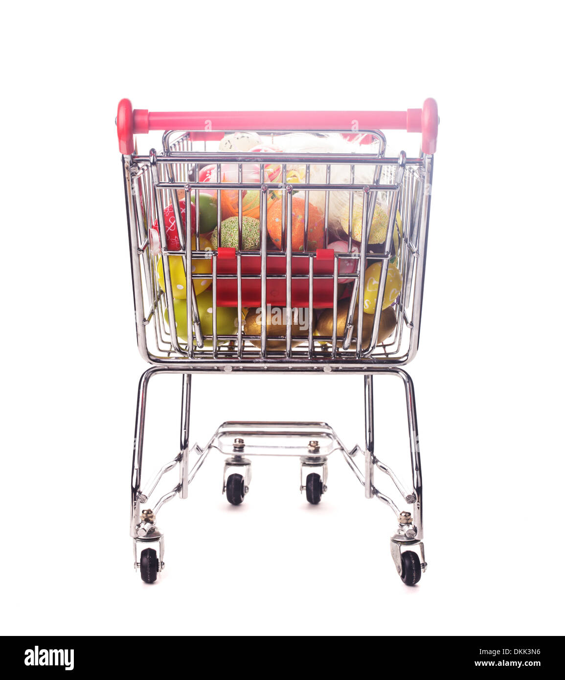 Shopping trolley with many decorative easter eggs on white Stock Photo