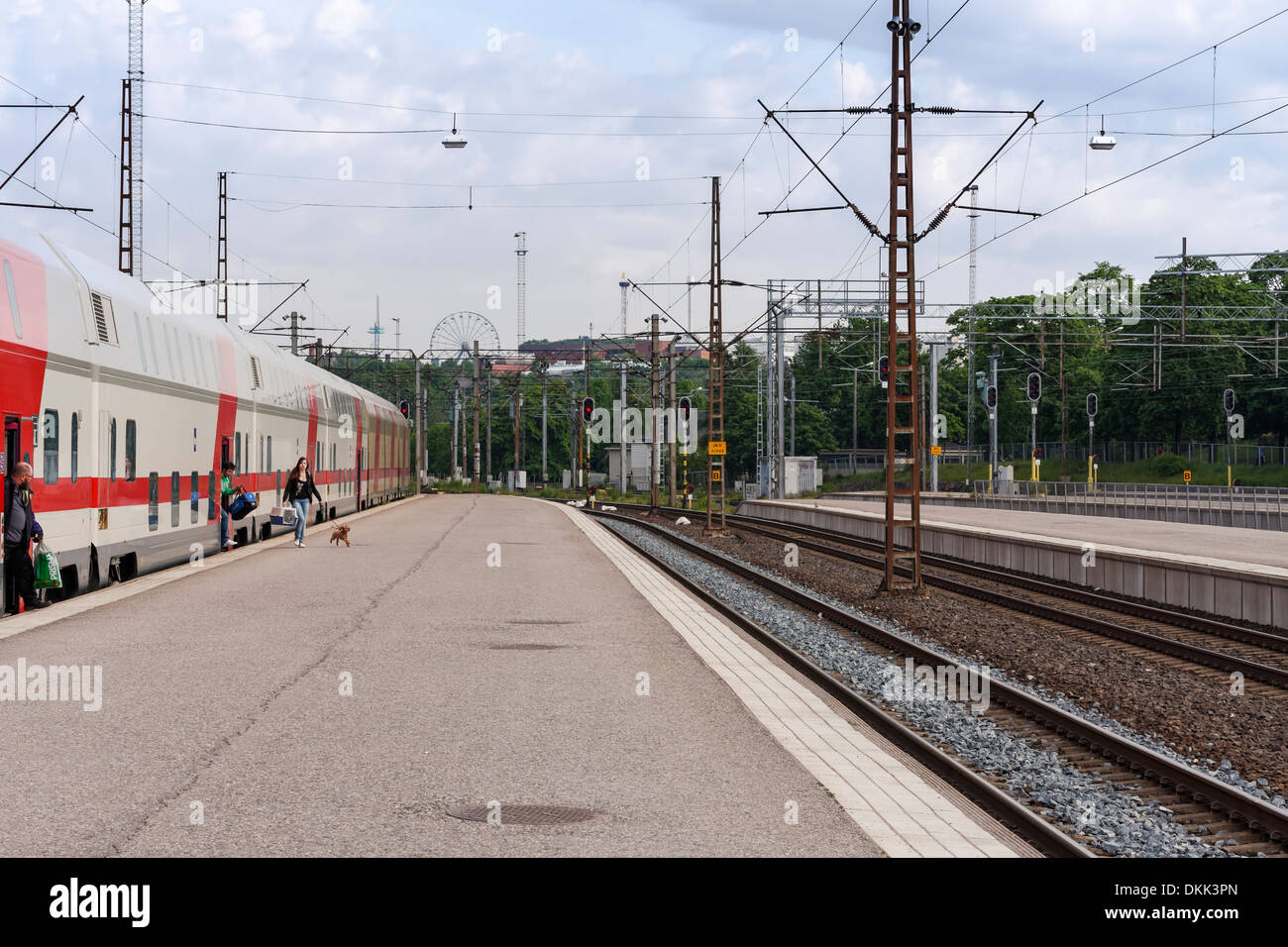 Passengers getting off a Pendolino train at Helsinki railway station on a summer day. Stock Photo