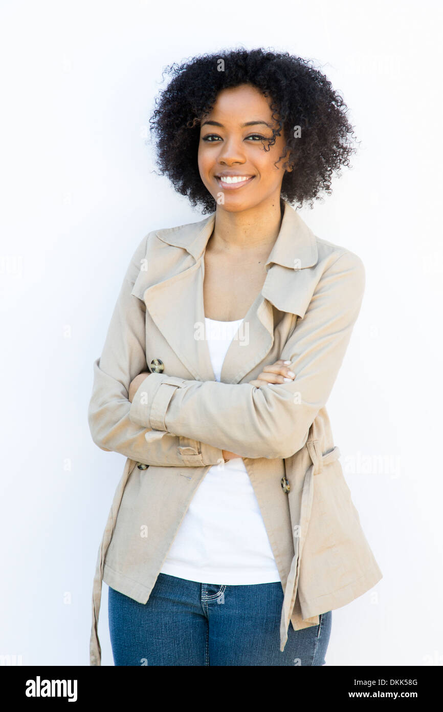 African American woman standing against a white background Stock Photo