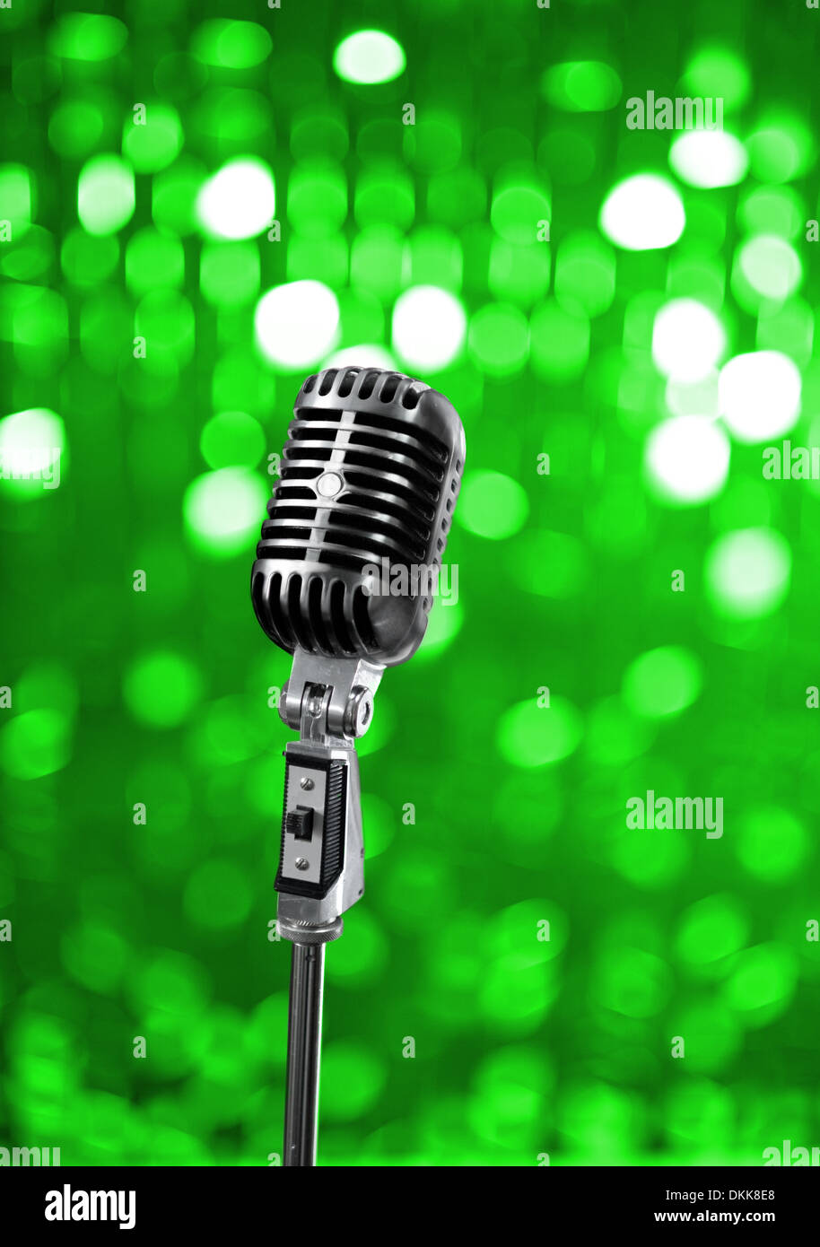 Retro mic on green stage Stock Photo