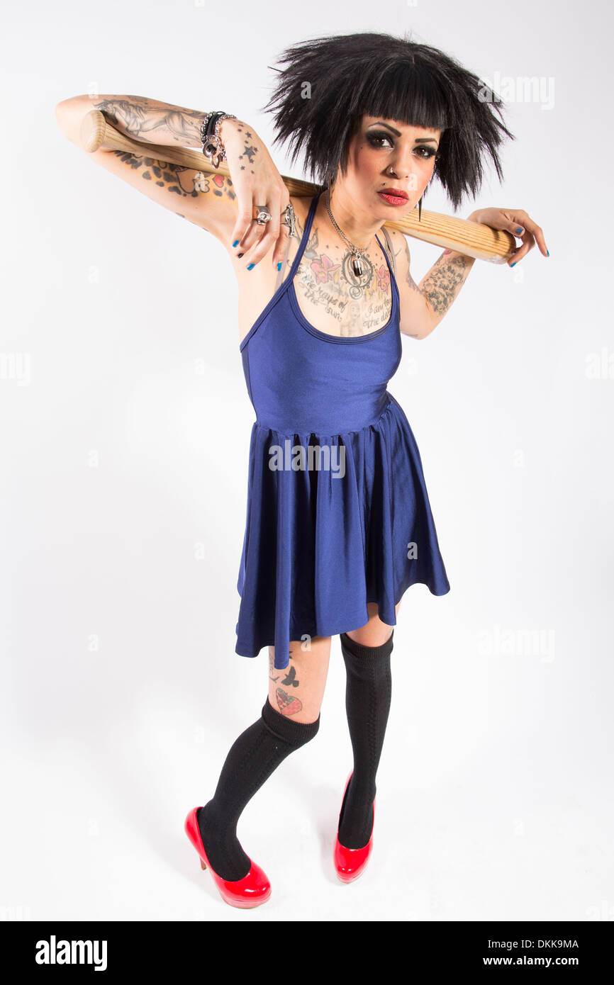 Young tattooed punk girl posing with baseball bat on white background Stock  Photo - Alamy