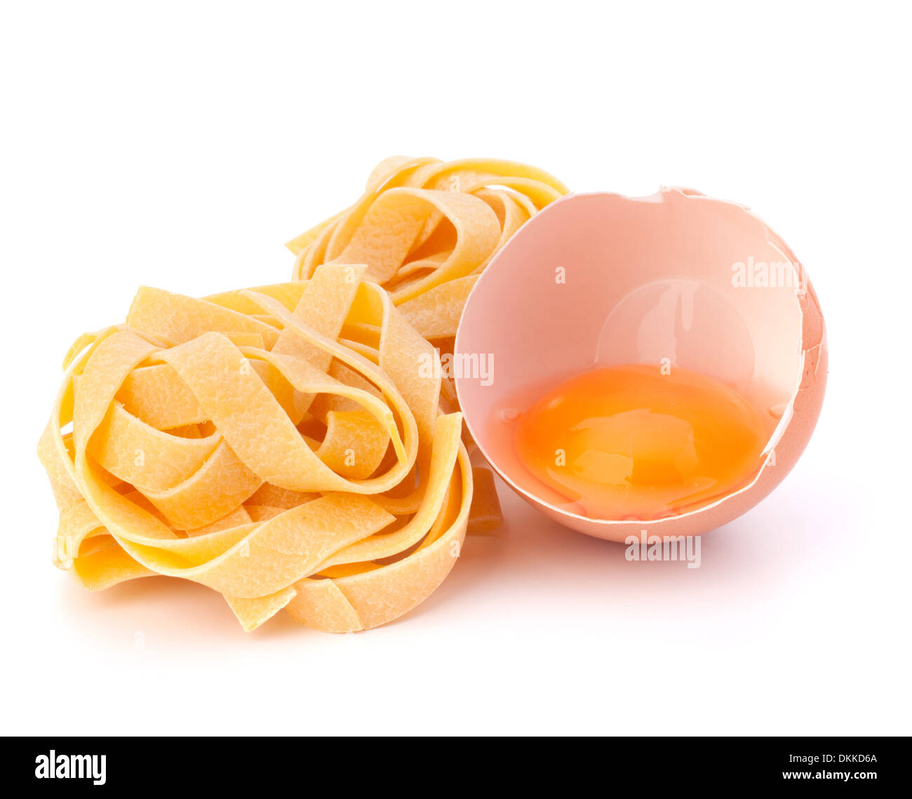 Italian egg pasta fettuccine nest isolated on white background Stock