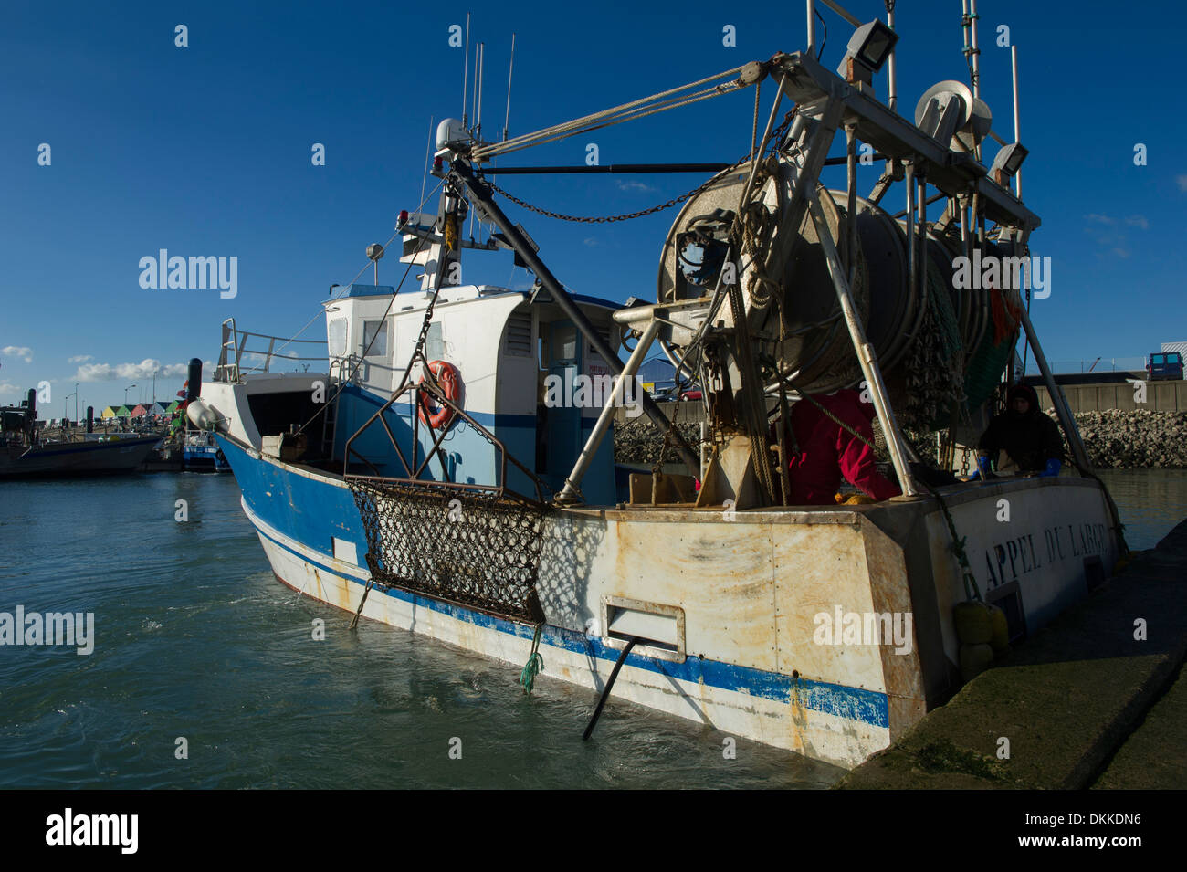A scallop fishing boat ready to descend its dredges Stock Photo