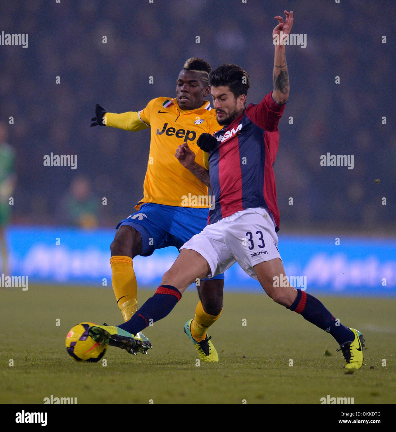 Bologna, Italy. 6thDec, 2013. Juventus' Paul Pogba (R) vies with Bologna's Panagiotis Kone during their Italian Serie A soccer match in Bologna, Italy, December 6, 2013. Juventus won 2-0. Credit:  Alberto Lingria/Xinhua/Alamy Live News Stock Photo