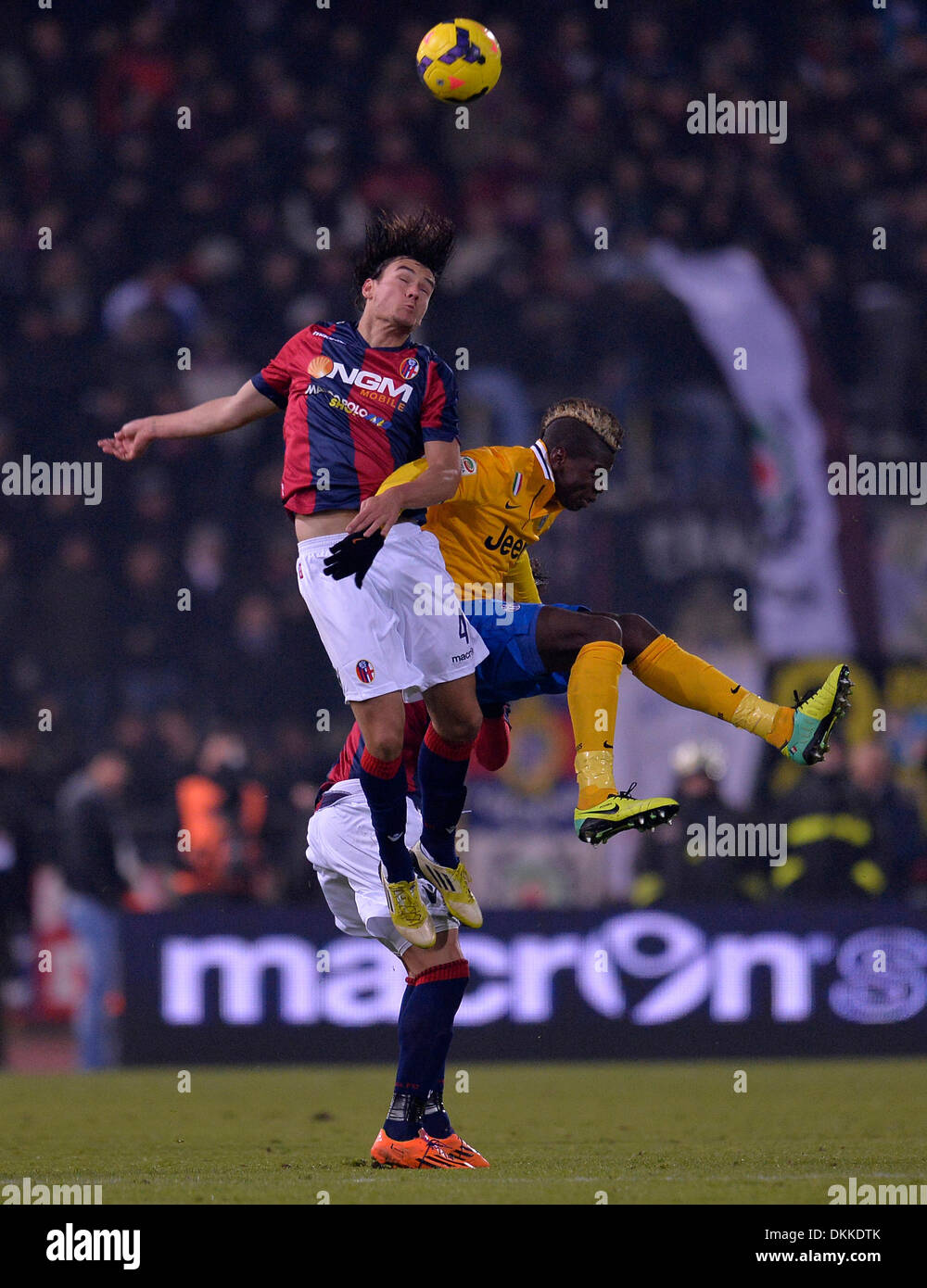 Bologna, Italy. 6thDec, 2013. Juventus' Paul Pogba (R) vies with Bologna's Rene Krhin during their Italian Serie A soccer match in Bologna, Italy, December 6, 2013. Juventus won 2-0. Credit:  Alberto Lingria/Xinhua/Alamy Live News Stock Photo