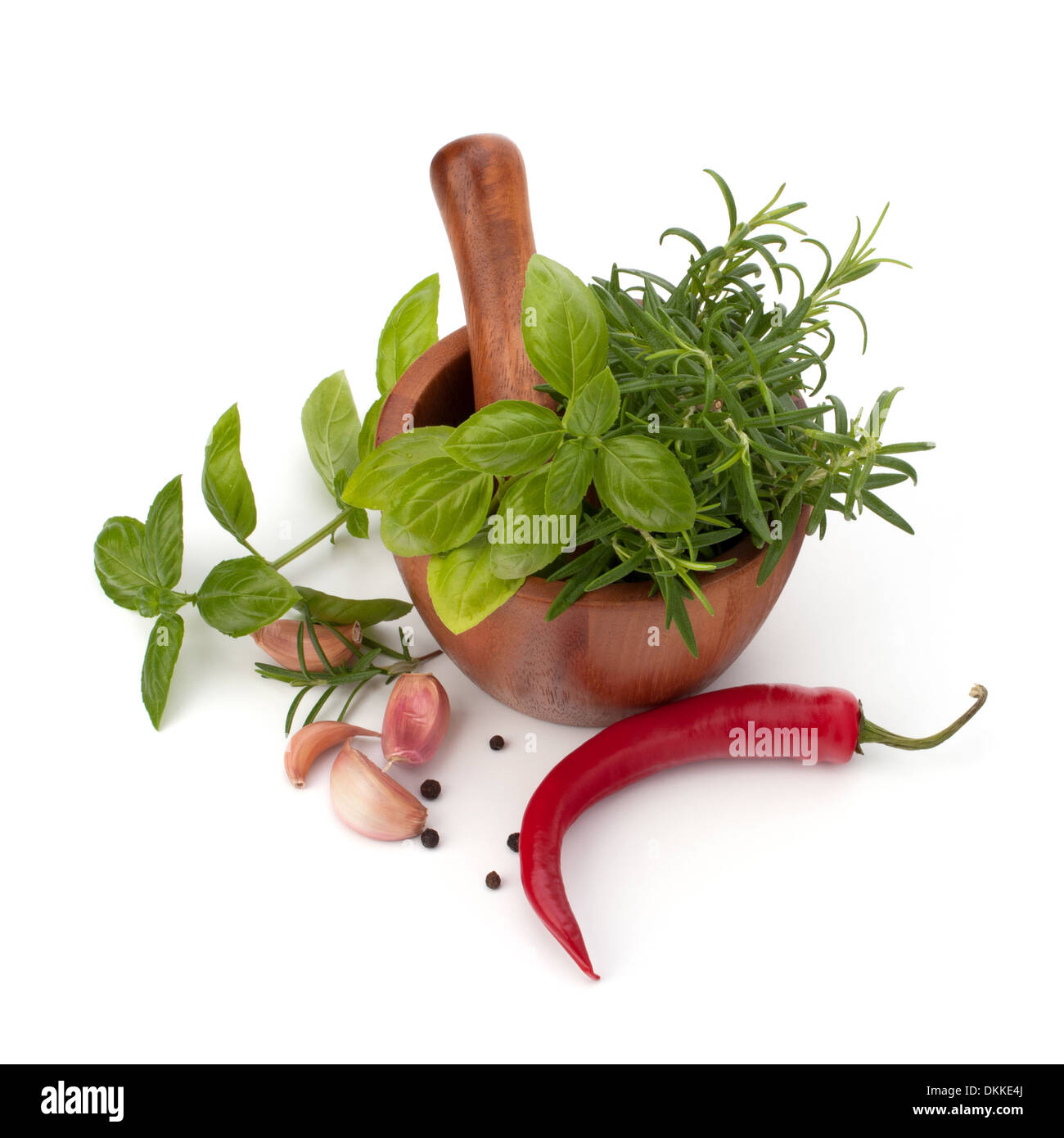 fresh flavoring herbs and spices in wooden mortar isolated on white ...