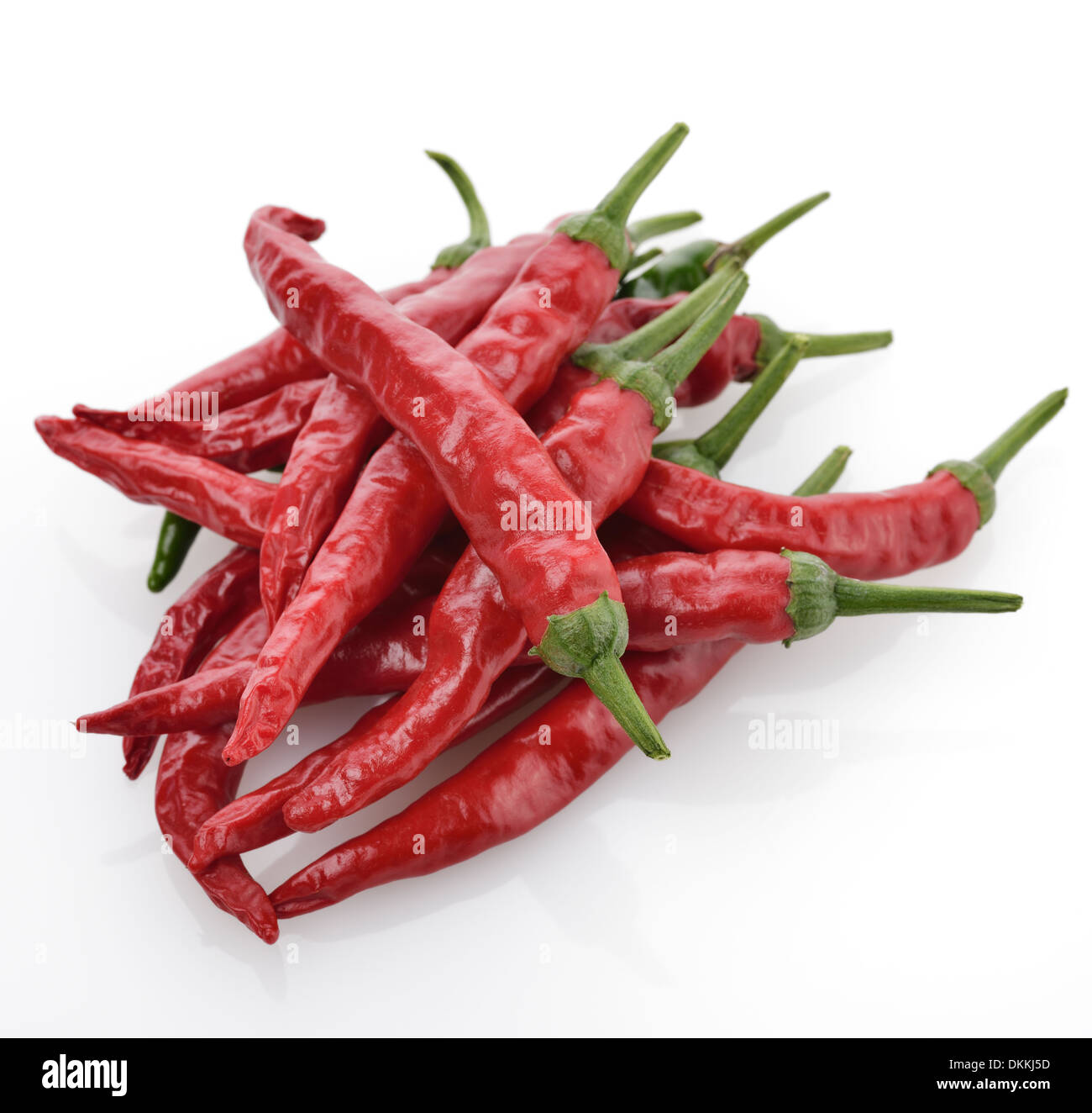 Pile Of Red Chili Peppers On White Background Stock Photo - Alamy