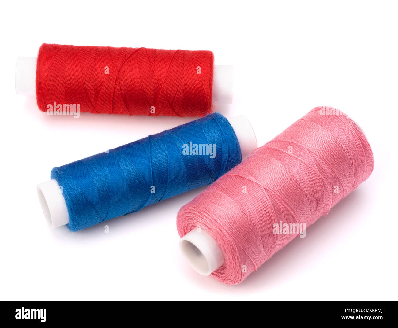 Colourful spools of thread isolated on white background Stock Photo - Alamy