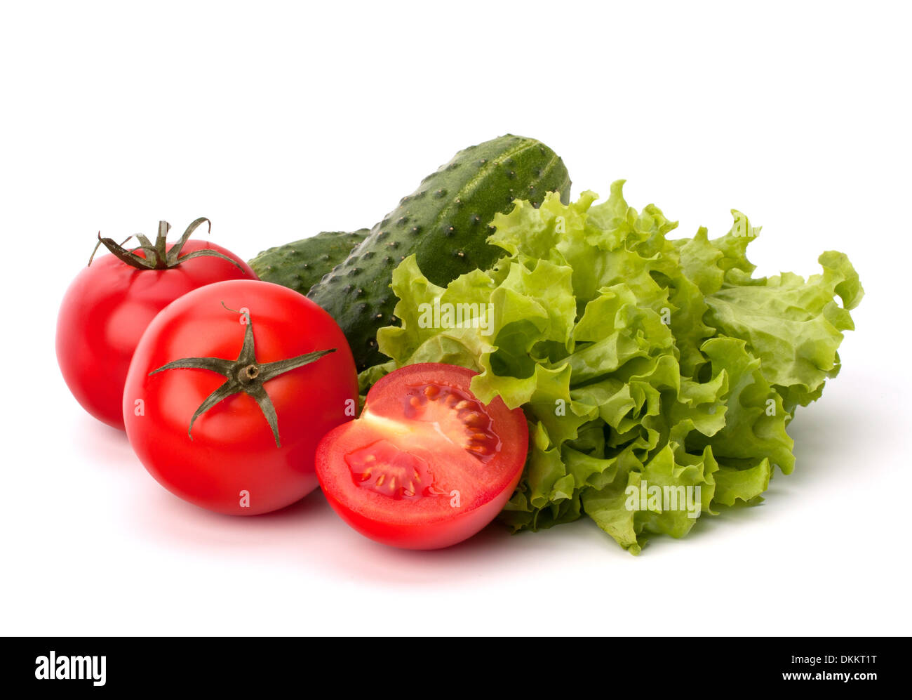 Tomato, cucumber vegetable and lettuce salad isolated on white ...