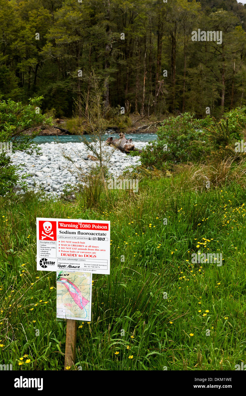 A warning sign that poisoned Possum baits are being used in the area in close proximity to a river. Stock Photo