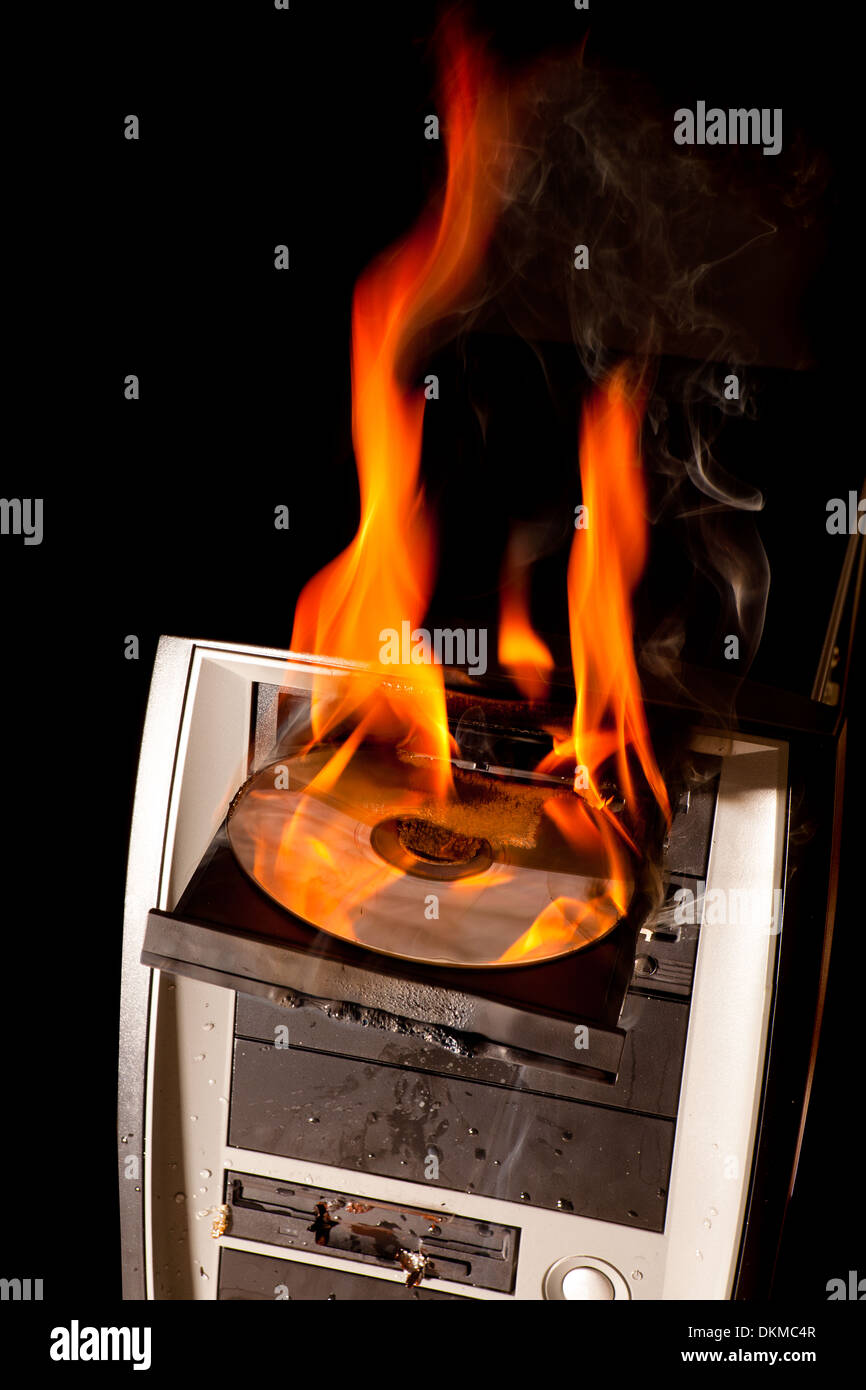 CD drive and entire computer on fire Stock Photo