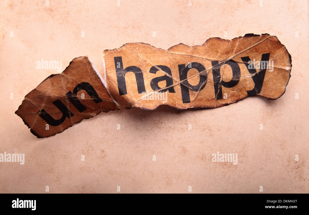 Word unhappy transformed into happy. Motivation Stock Photo