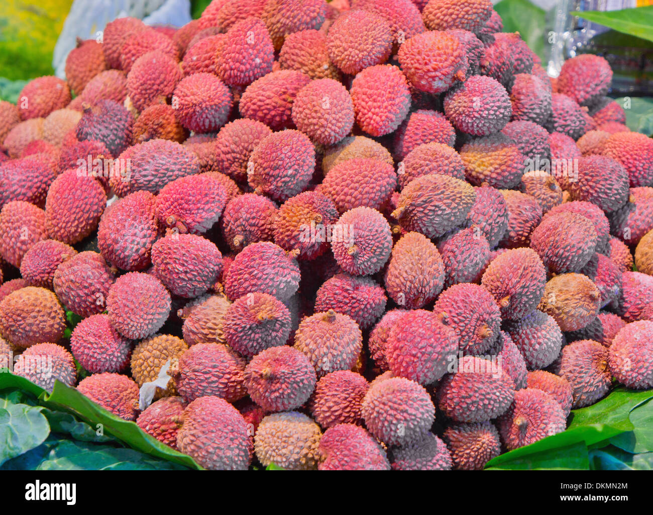 A bunch of fresh lychees on a market stall Stock Photo