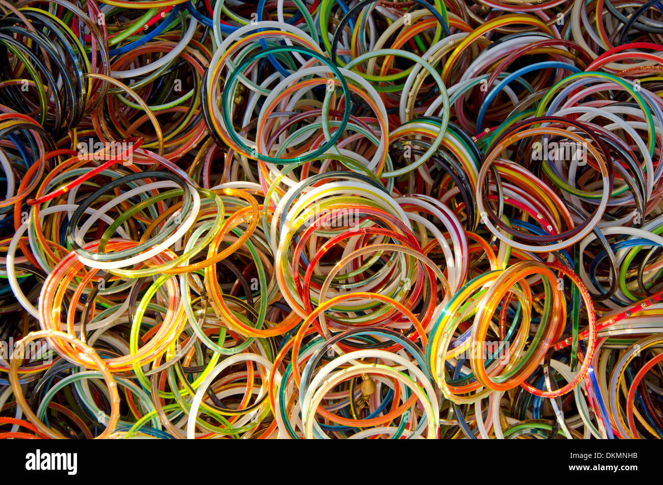 Colorful Plastic Bracelets for sale on a second hand market in Fuengirola  ,Spain Stock Photo - Alamy
