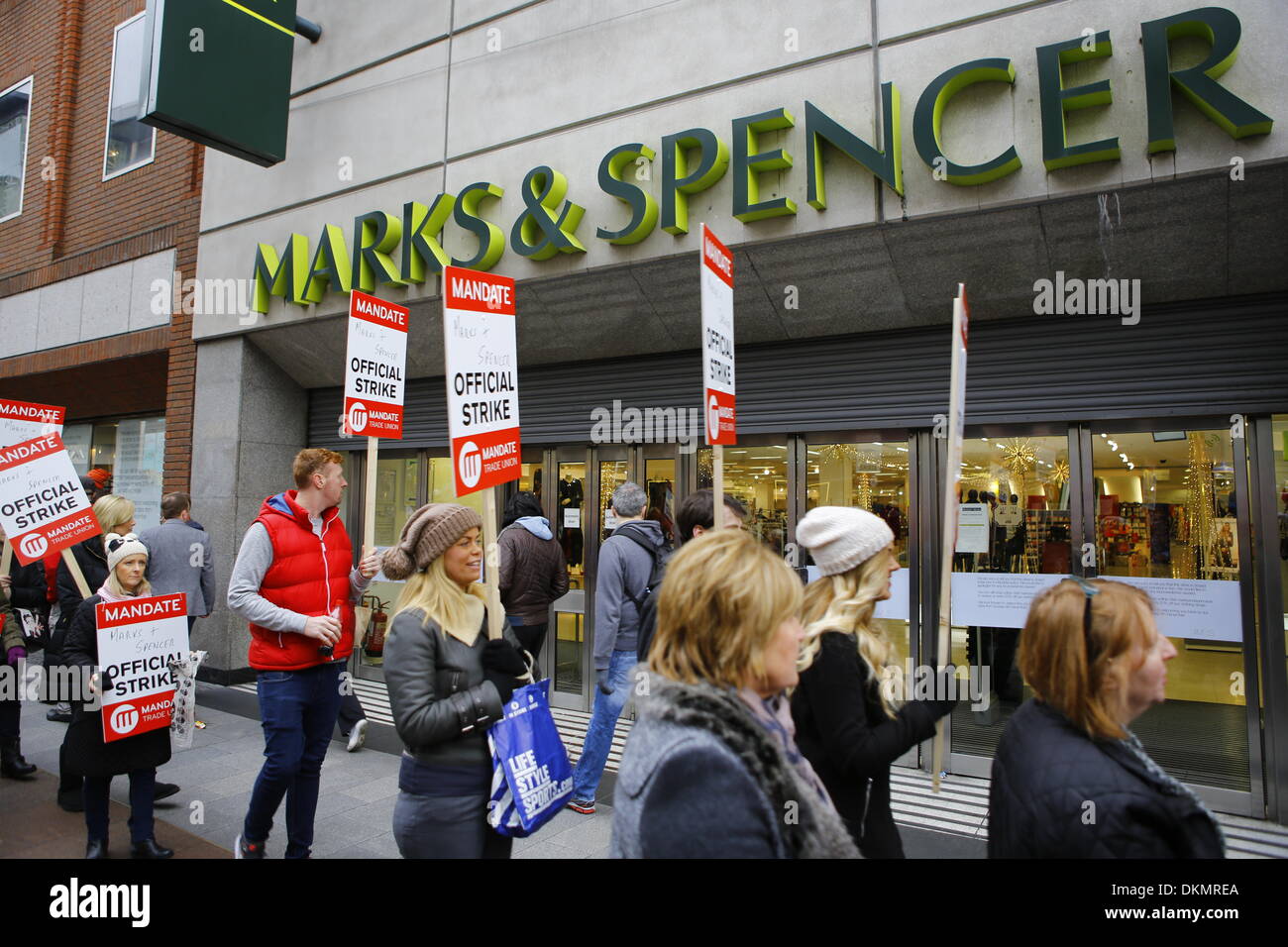 Dublin, Ireland. 7th December 2013. Striking Marks & Spencer employees picket the Mary Street store in Dublin. Over 2000 Marks & Spencer employee from the MANDATE Trade Union went on their first of 3 strike days, closing all 17 Irish M & S stores. The strike is over the unilateral closing of the defined pension benefit scheme by Marks & Spencer in October. Credit:  Michael Debets/Alamy Live News Stock Photo