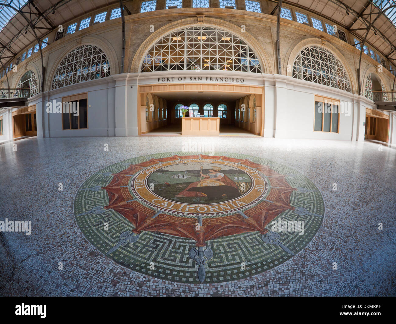 The interior of the second floor of the San Francisco Ferry Building.  Great Seal of the State of California in the foreground. Stock Photo