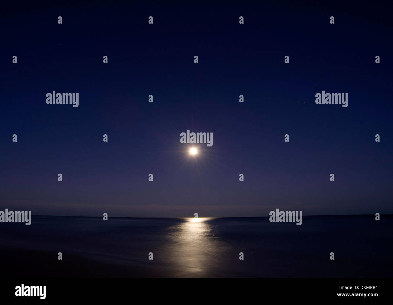 Full moon over beach Stock Photo - Alamy