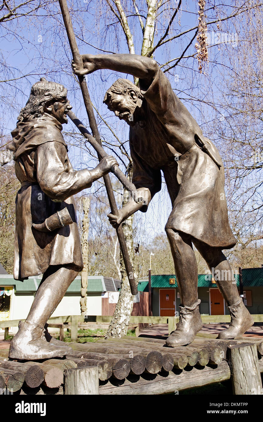 A statue group showing Robin Hood and Little John fighting with quarter staffs in the grounds of the Sherwood visitors center. Stock Photo