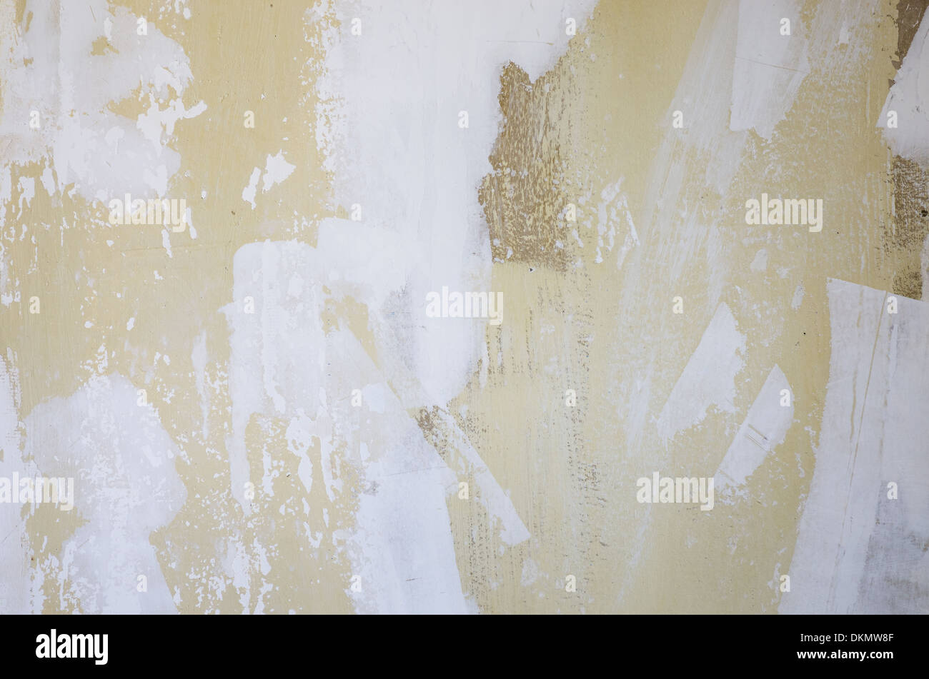 old grunge wall background with flaking and spackled light and dark sections Stock Photo