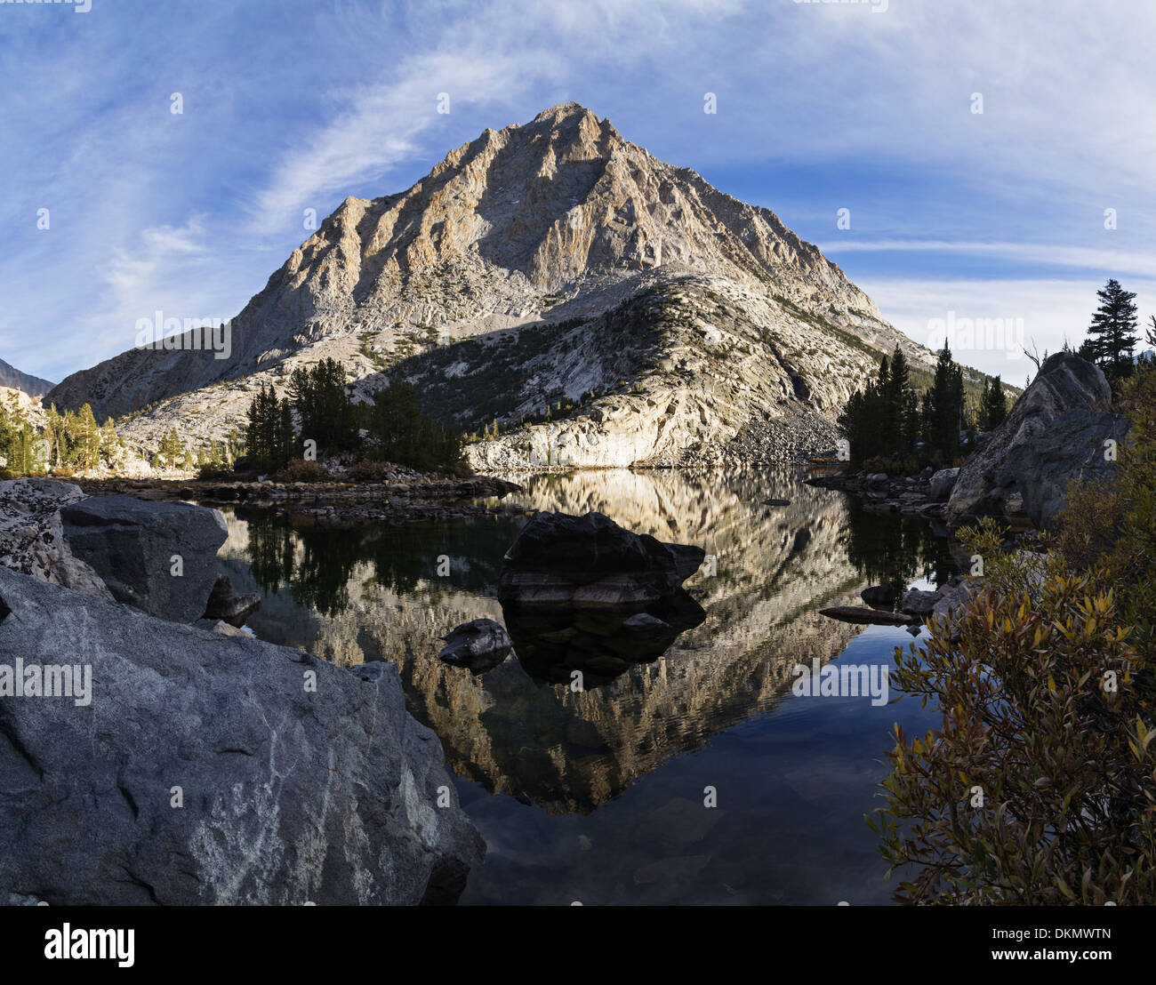 reflection of mountain in Pine Lake in the Sierra Nevada mountains Stock Photo