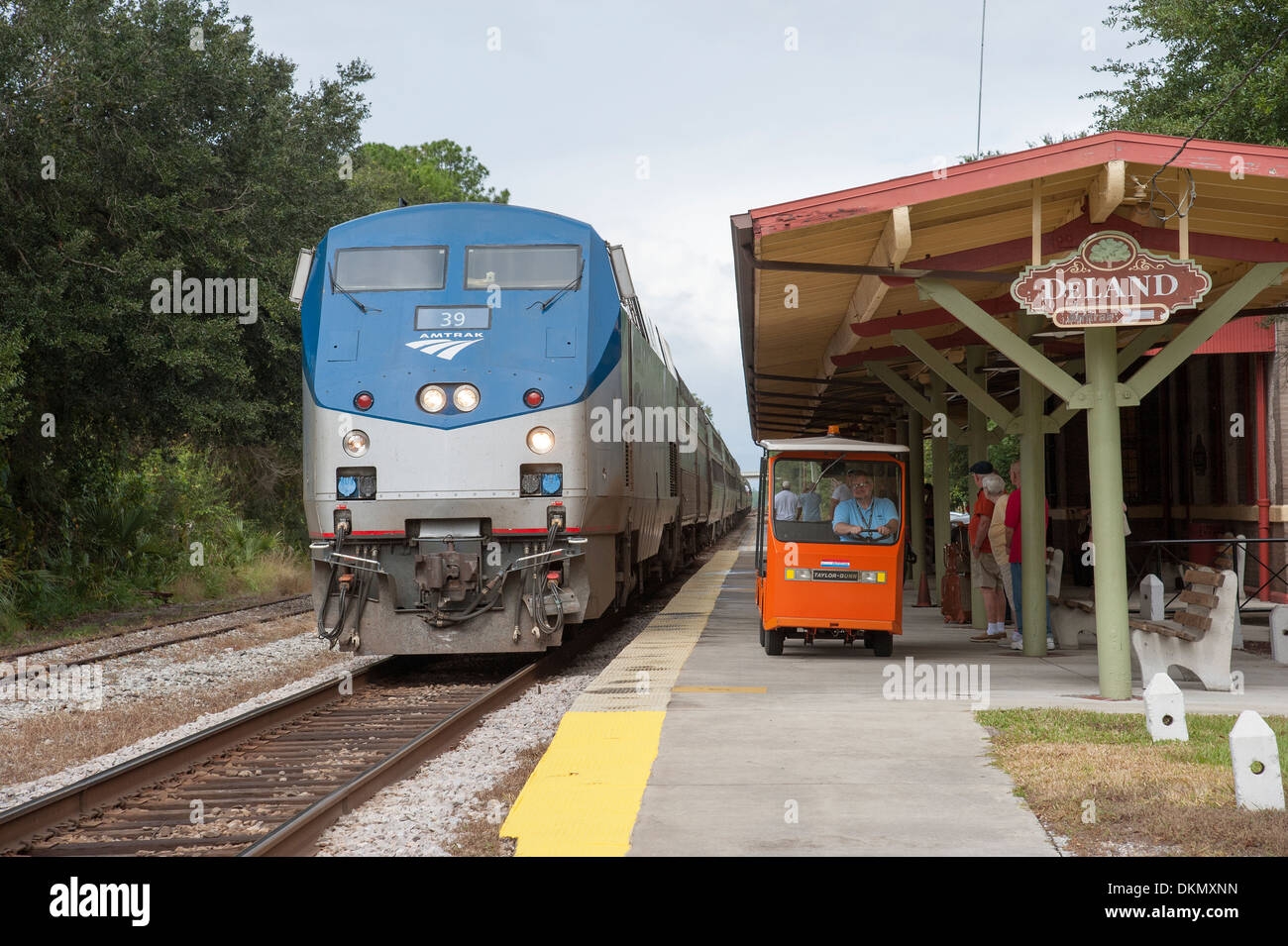 Amtrak passenger train and baggage truck at DeLand Station Florida USA