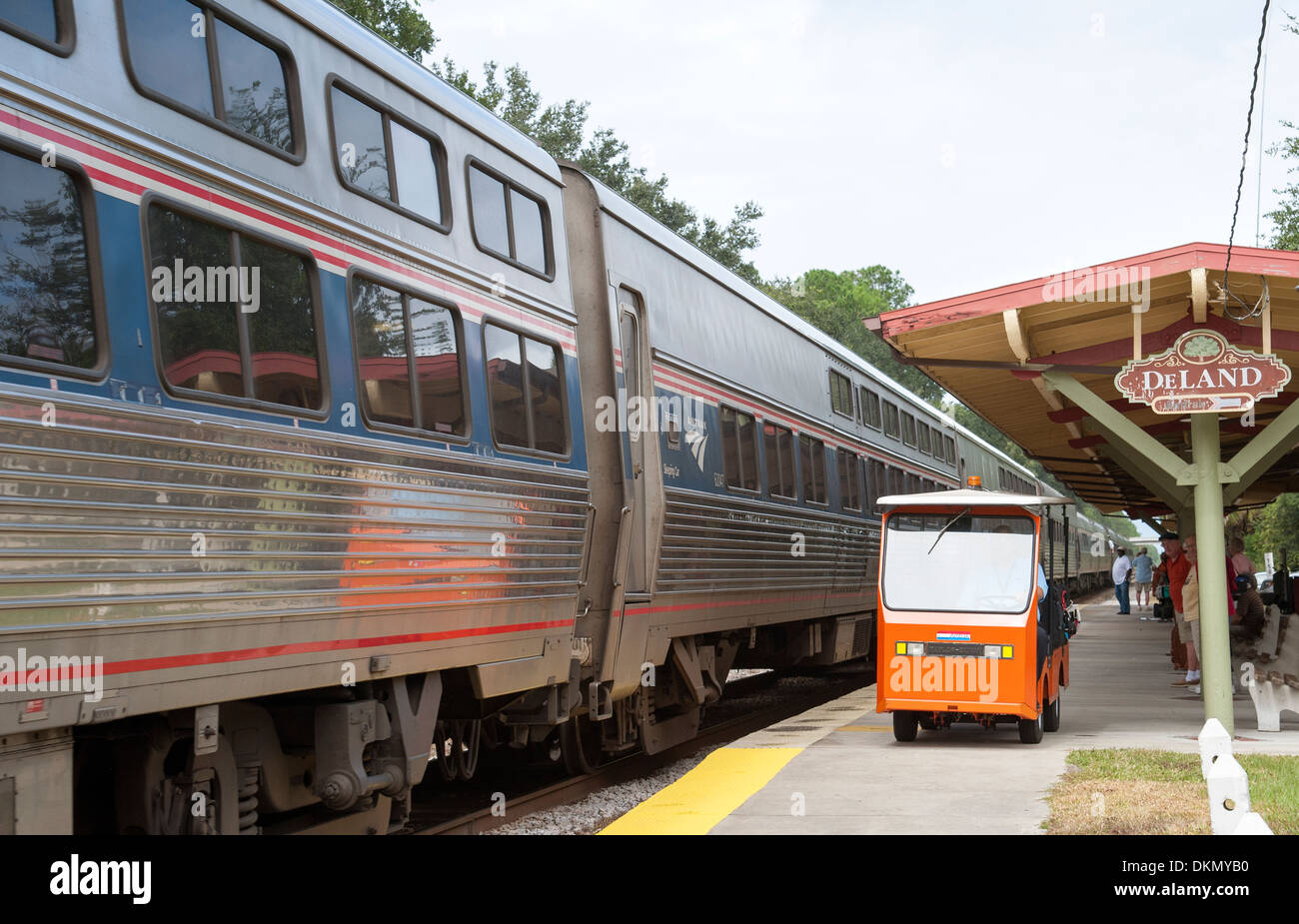 Amtrak passenger train and baggage truck at DeLand Station Florida USA