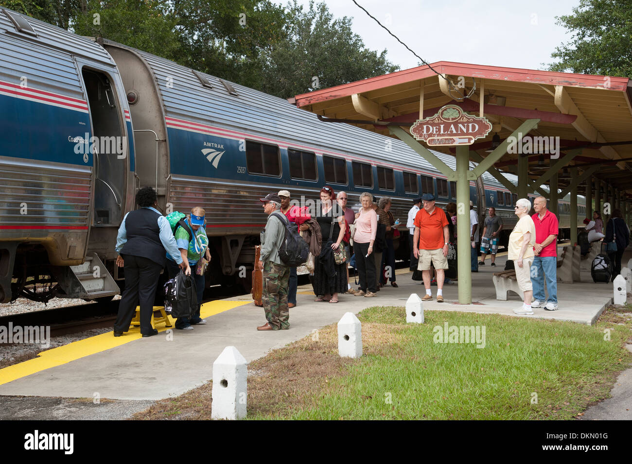 Amtrak passenger train and passengers at DeLand Station Florida USA