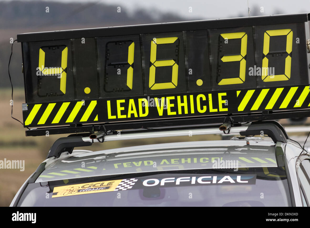 Large elapsed digital display race timer on lead vehicle, Cicle Classic Race 2013 cycle race. Stock Photo