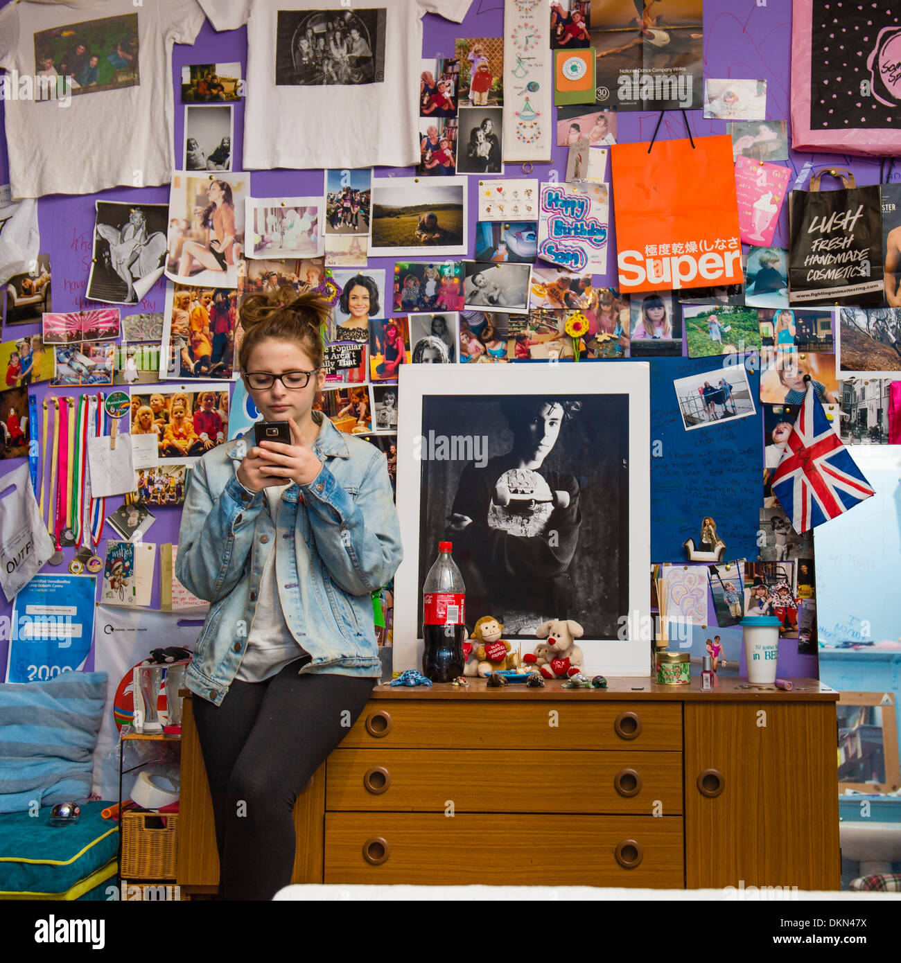 A 15 Year Old Teenage Girl Wearing Glasses In Her Bedroom