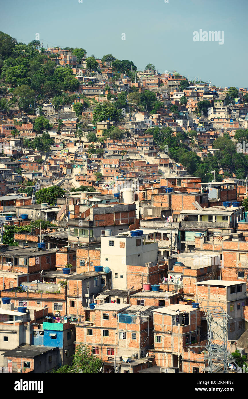Brazilian favela shantytown slum covers the hillside in Rio de Janeiro Brazil Complexo Alemao Stock Photo