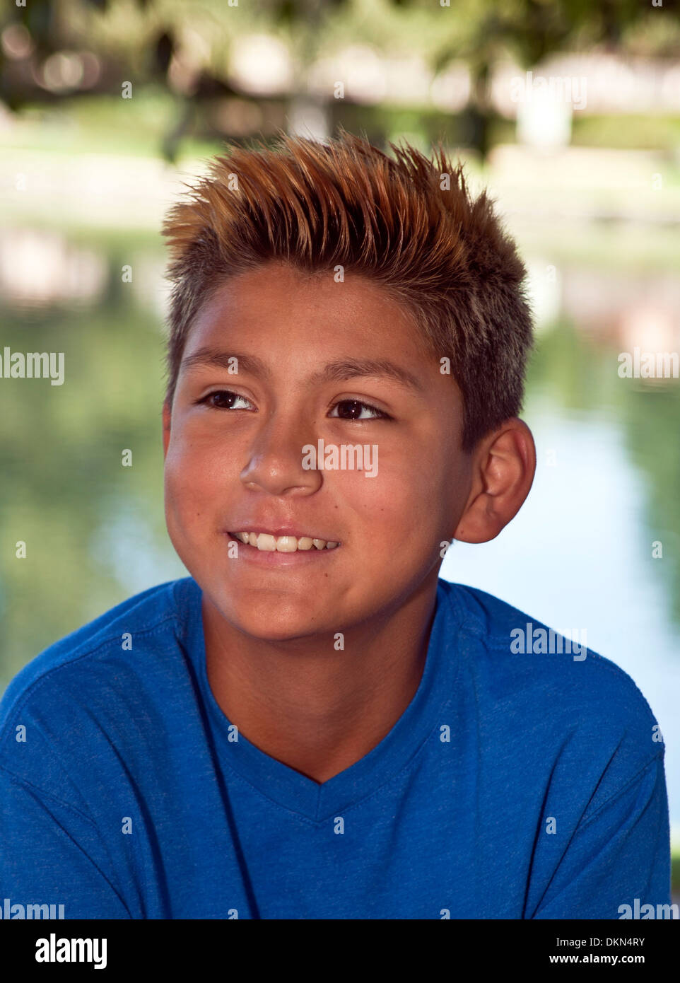 young person people Trendy fashionable Tween tweens Hispanic boy in park. MR © Myrleen Pearson Stock Photo