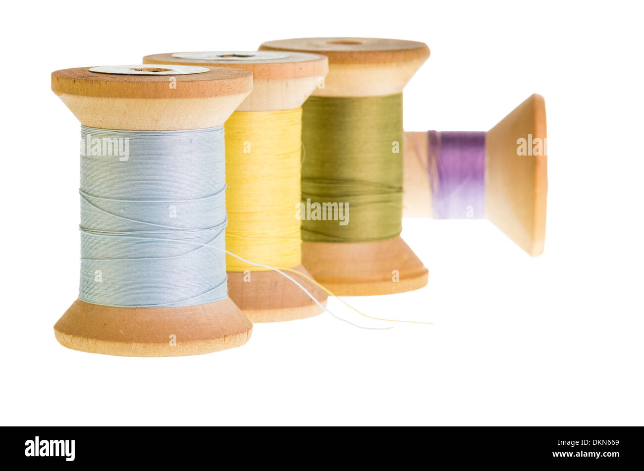 Four spools of sewing thread isolated on white Stock Photo