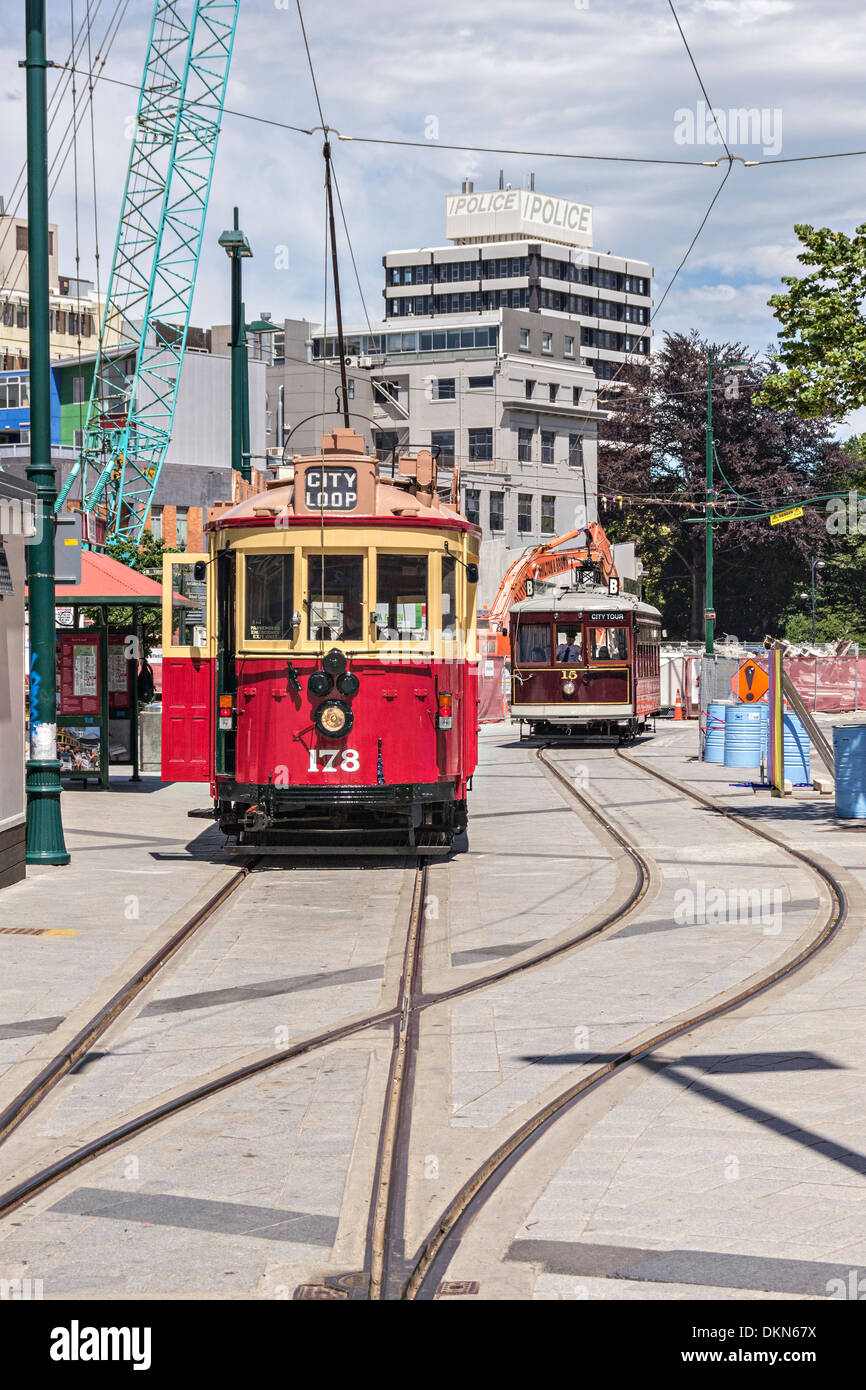Trams in Cathedral Square, Christchurch, New Zealand. Much of the track was damaged in the February 2011 earthquake, and the... Stock Photo
