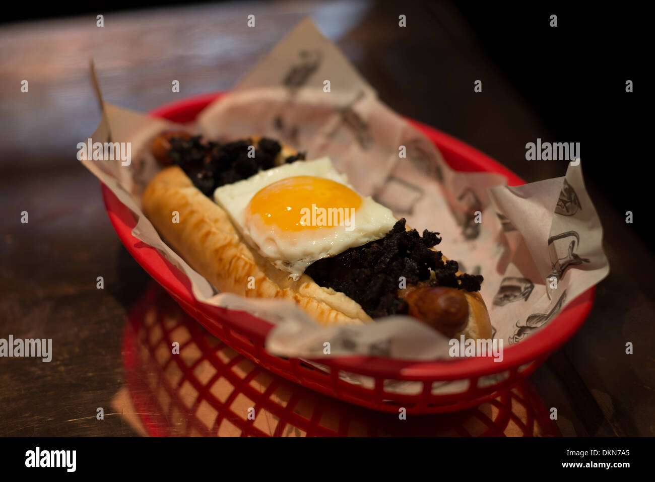 Hotdogs at fashionable London restaurant Bubbledogs that pairs hotdogs with champagne. Stock Photo