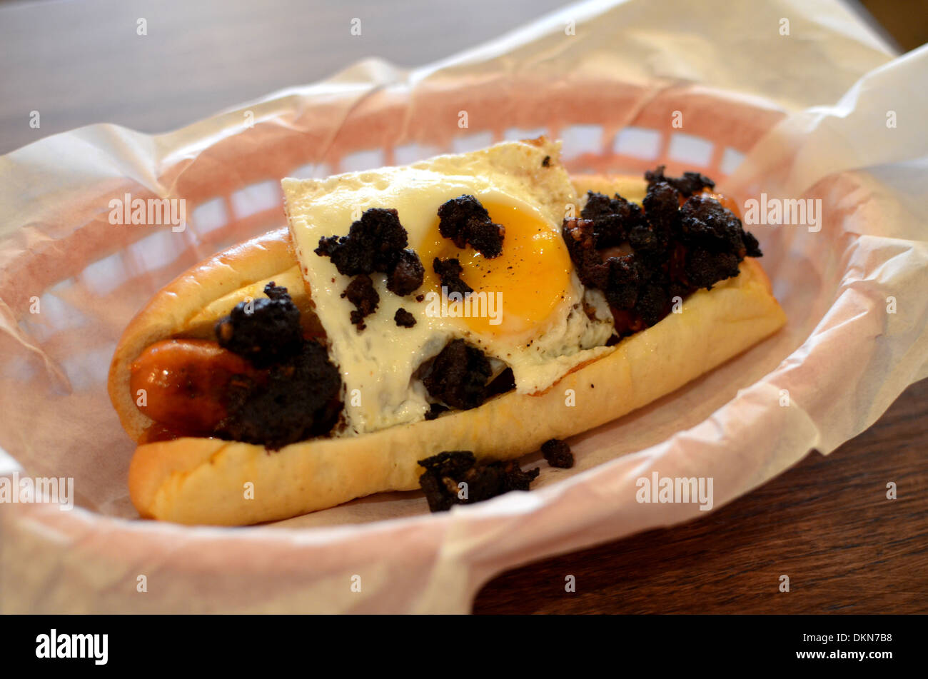 Hotdogs at fashionable London restaurant Bubbledogs that pairs hotdogs with champagne. Stock Photo