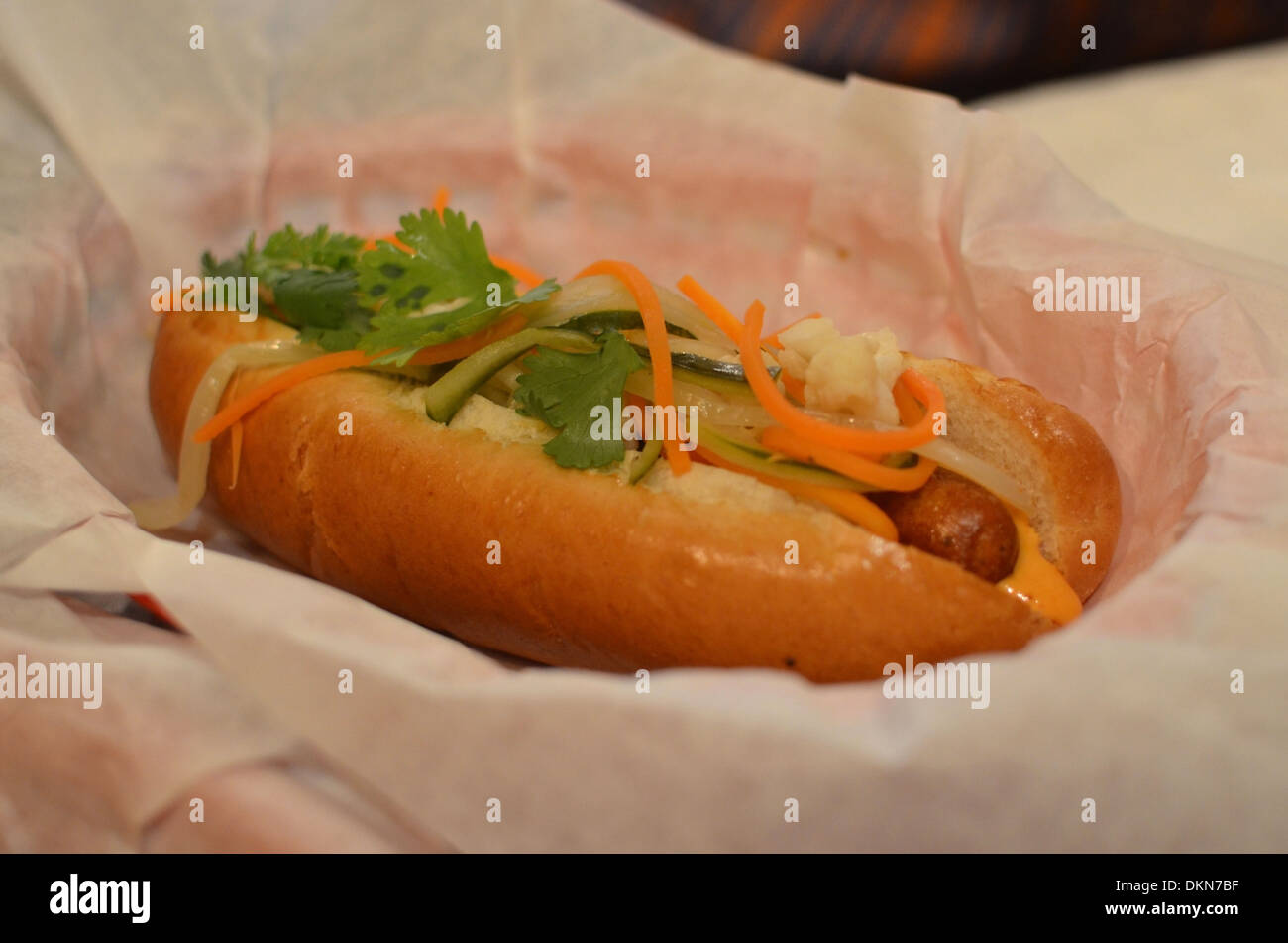 Hotdogs at fashionable London restaurant Bubbledogs that pairs hotdogs with champagne. Stock Photo